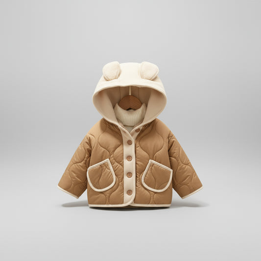 Children's brown quilted jacket with white trim on a neutral background, featuring 'La Chapelle Kids' branding.
