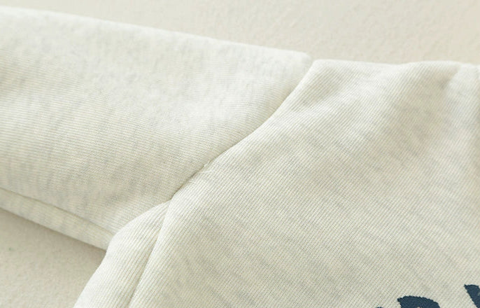 Close-up of textured fabric with a neutral color palette
