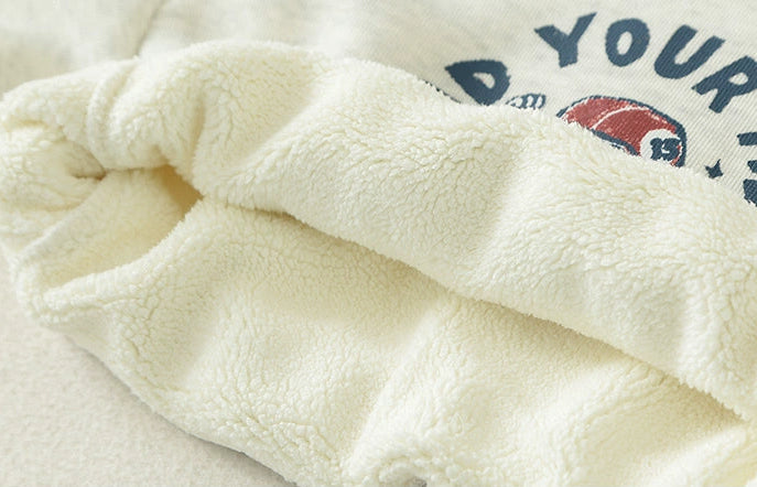 Close-up of soft fabric with a brand logo in the background