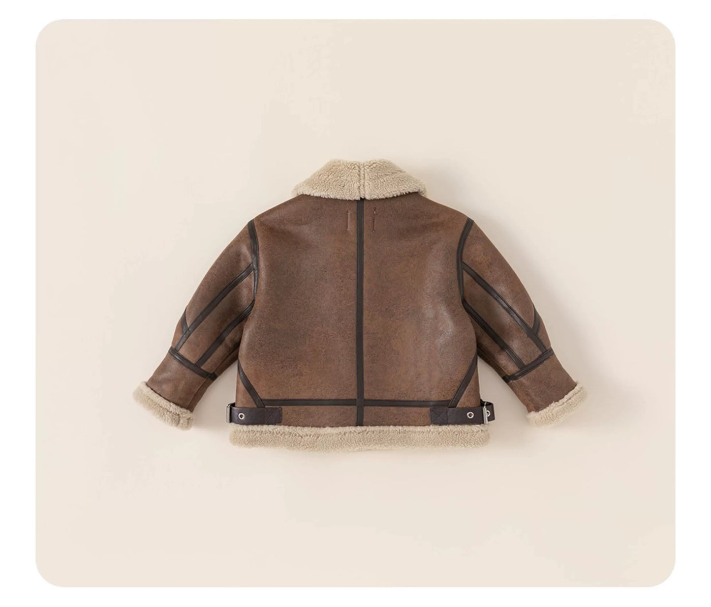 Brown leather jacket with shearling lining on a beige background